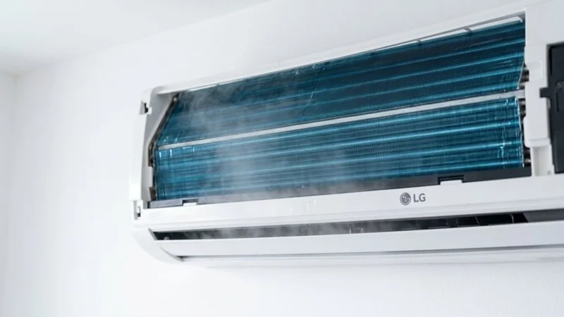 Clean LG aircon indoor unit with open panel showing freshly serviced evaporator coil